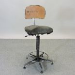 A vintage metal machinist's chair