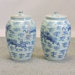 A pair of Chinese porcelain blue and white jars and covers,