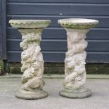 A pair of reconstituted stone bird baths,