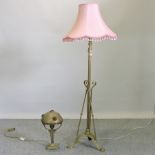 An Art Nouveau brass standard lamp and shade, together with a similar table lamp,