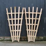 An oak fan shaped garden trellis, together with another,