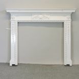 A cream painted pine fire surround,