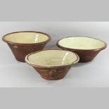 Three pottery dairy bowls,