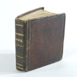 A miniature leather bound volume, Pictures of Roman History, designed by Alfred Mills,