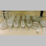 A collection of cut glass drinking glasses, together with bowls,