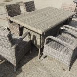 A beige rectangular rattan garden table, 150 x 90cm,