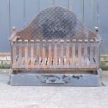 A wrought iron fire grate, with tray below,