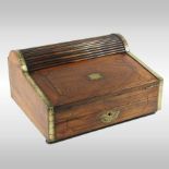 A 19th century walnut writing slope, with a tambour front and hinged fall,