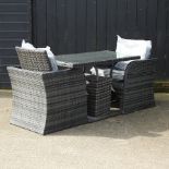 A rattan garden table with a glass top, 120 x 60cm,