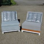 A grey upholstered all-weather garden armchair by Sunbrella,