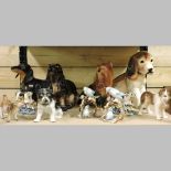 A collection of china models of animals, to include a spaniel,