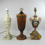 An ornate gilt mounted porcelain table lamp, together with two others,