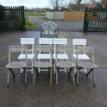 A teak extending garden table, 240 x 120cm overall,