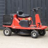 A red Lawnflite petrol ride-on lawnmower