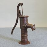 An antique style metal garden pump