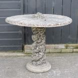 A reconstituted stone circular garden table,