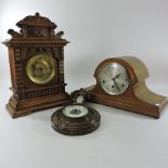 An early 20th century oak mantel clock, 33cm high,