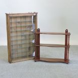 A pine glazed hanging cabinet, together with a mahogany wall shelf,