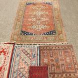 A Turkish rug, with four medallions, on a red ground, 350 x 250cm,