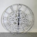 A large decorative metal wall clock,