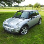 A silver 2003 Mini Cooper, 1600cc, showing 136,000 miles,