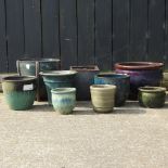 A collection of glazed plant pots,