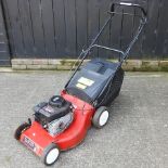 A Champion petrol lawn mower