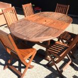 A teak extending garden table, 172 x 106cm,