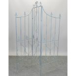 A painted folding metal garden screen,