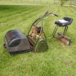 A Webb petrol driven ride-on cylinder lawnmower