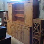 An unusually large antique pine dresser,