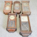 A collection of five various wall clocks