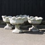 A pair of reconstituted stone garden urns, each 47cm,