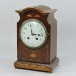 An Edwardian mahogany and inlaid mantel clock,