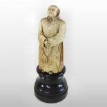 A 19th century carved figure of a Benedictine monk,