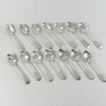 A matched set of thirteen 19th century and later silver fiddle pattern spoons,