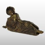 An early 20th century American erotic bronze figure, of a reclining lady, with a hinged coat,