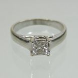 A gold princess cut single stone diamond ring, approximately 0.