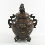 A Japanese bronze and mixed metal koro, the lid decorated with a seated monkey,