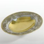 An early 20th century French silver plated and gilt pedestal dish, of oval shape,