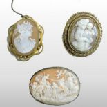 A cameo brooch, of oval shape, depicting a Grecian scene with figures and a chariot,