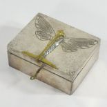 An early 20th century pewter box and cover, decorated in relief with a butterfly,