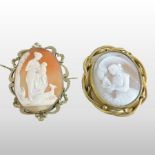 A cameo brooch, of oval shape, depicting a mother feeding a child from a drinking horn,