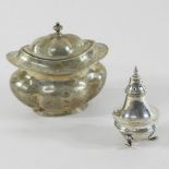 An Edwardian silver tea caddy, Chester 1906, 11cm, together with a silver pepper, Chester 1914,