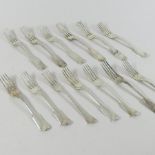 A matched set of thirteen Victorian and later silver fiddle pattern dessert forks,