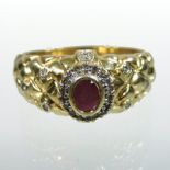 A large 18 carat gold ruby and diamond cluster ring,