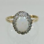 A 9 carat gold opal and diamond cluster ring