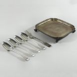 An early 20th century silver waiter, of square shape, on scrolled feet, Sheffield 1939, 19cm wide,