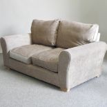 A cream upholstered Shreiber two seater settee,