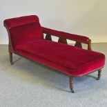 A Victorian mahogany red upholstered chaise longue,